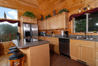 Pigeon Forge Two Bedroom Plus Loft Cabin Rentals with seating for 9 in the kitchen area